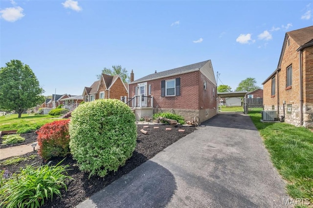336 Tacoma Dr, Saint Louis, MO 63125 - view of property exterior featuring brick siding, a residential view, and central AC unit