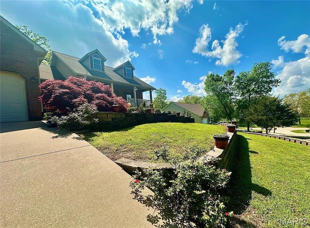 13 Montauk Ct, Leadington, MO 63601 - view of side of home featuring a lawn and a garage