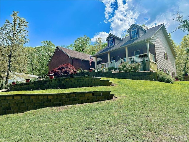 13 Montauk Ct, Leadington, MO 63601 - view of side of property with a porch and a lawn