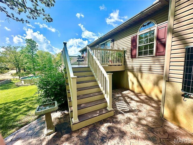 13 Montauk Ct, Leadington, MO 63601 - view of home's exterior featuring stairs, a yard, and a deck