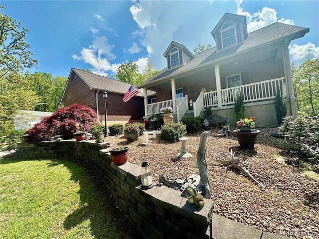 13 Montauk Ct, Leadington, MO 63601 - view of front of house featuring covered porch and a front lawn