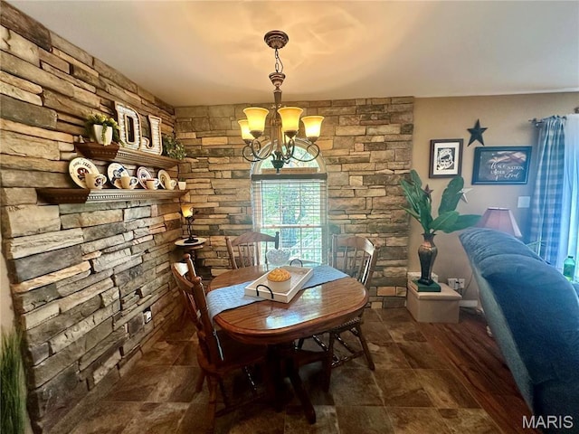 13 Montauk Ct, Leadington, MO 63601 - dining space featuring a chandelier and stone finish floors