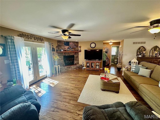 13 Montauk Ct, Leadington, MO 63601 - living room with ceiling fan, wood finished floors, and a fireplace