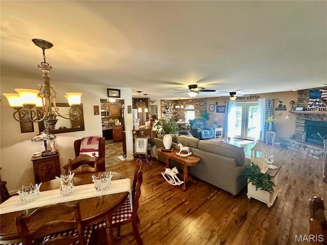 13 Montauk Ct, Leadington, MO 63601 - living area with hardwood / wood-style floors, ceiling fan, and a fireplace