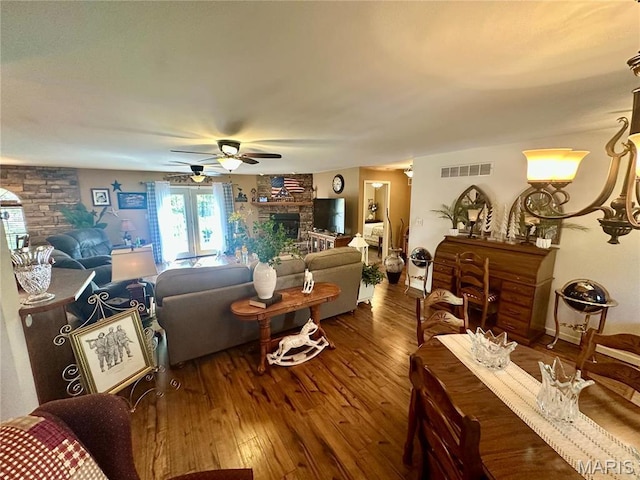 13 Montauk Ct, Leadington, MO 63601 - living area featuring a stone fireplace, hardwood / wood-style flooring, and ceiling fan