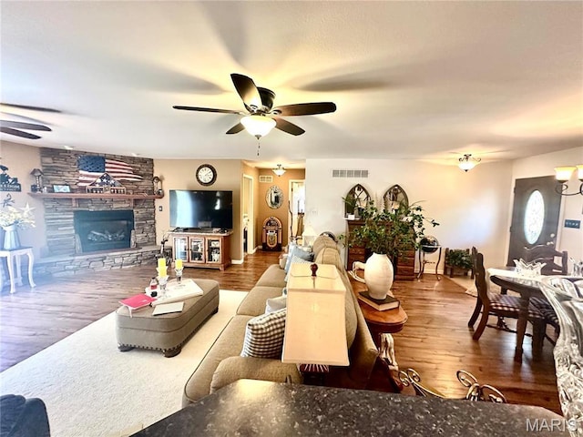 13 Montauk Ct, Leadington, MO 63601 - living room with ceiling fan, a fireplace, and wood finished floors