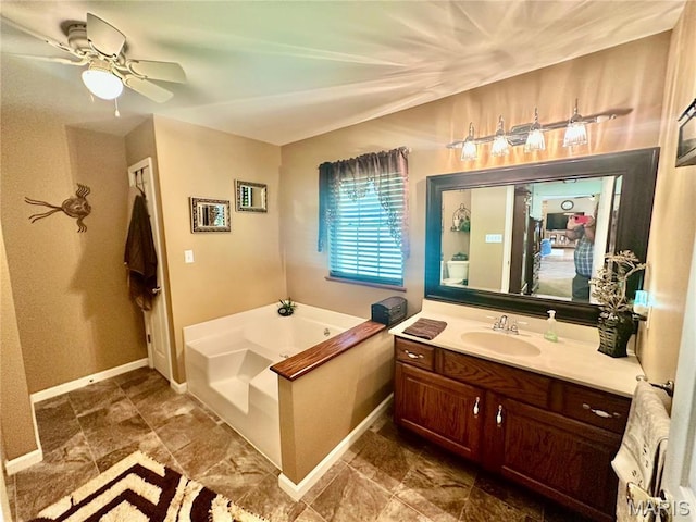 13 Montauk Ct, Leadington, MO 63601 - full bath featuring vanity, a garden tub, ceiling fan, and baseboards