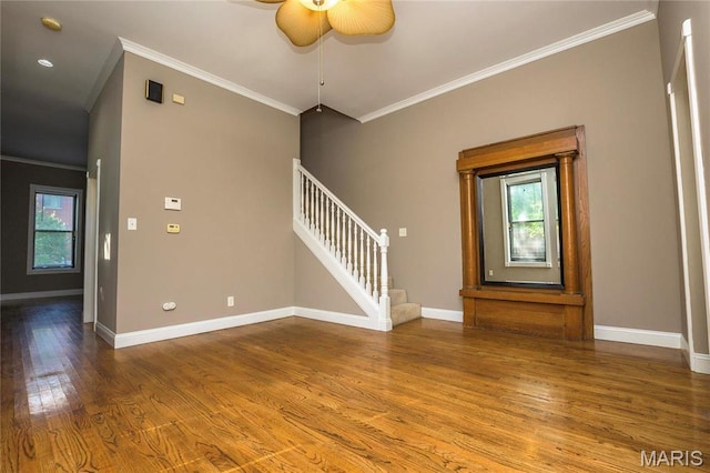 1703 Carroll St, Saint Louis, MO 63104 - unfurnished room featuring stairs, crown molding, wood finished floors, and baseboards