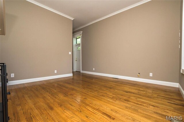 1703 Carroll St, Saint Louis, MO 63104 - unfurnished room with wood finished floors, crown molding, and baseboards