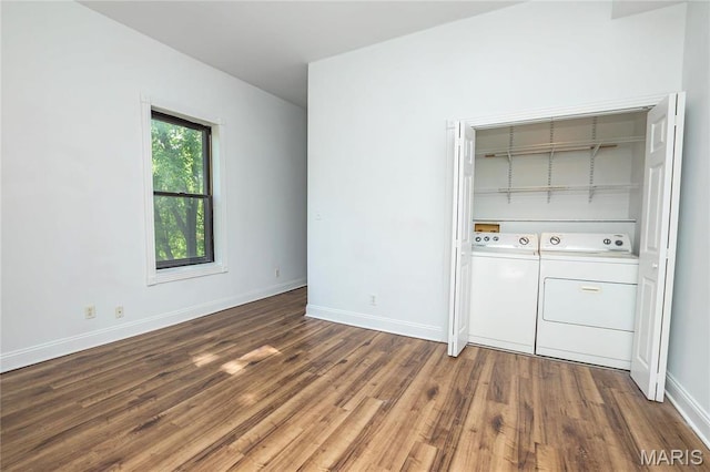 1703 Carroll St, Saint Louis, MO 63104 - empty room with separate washer and dryer, wood finished floors, and baseboards