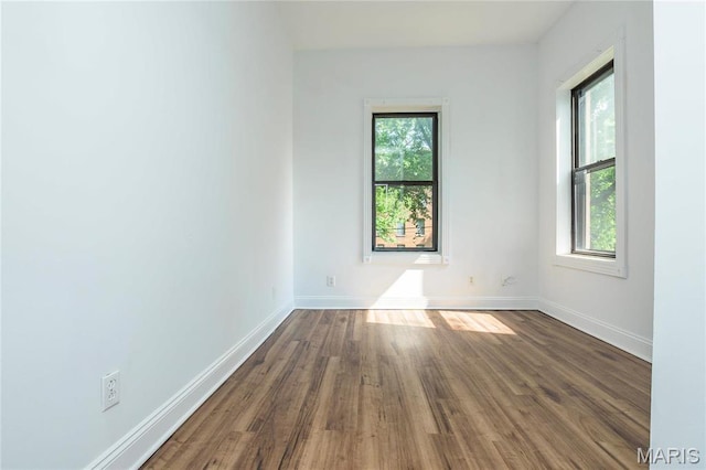 1703 Carroll St, Saint Louis, MO 63104 - unfurnished room with baseboards and dark wood finished floors