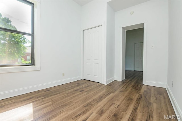 1703 Carroll St, Saint Louis, MO 63104 - spare room with wood finished floors and baseboards