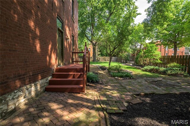 1703 Carroll St, Saint Louis, MO 63104 - fenced backyard featuring a patio