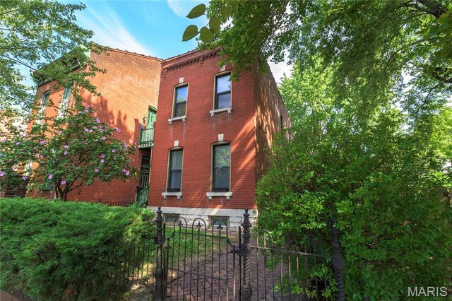 1703 Carroll St, Saint Louis, MO 63104 - view of side of home featuring brick siding