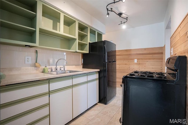 1745 Venice Ave, Granite City, IL 62040 - kitchen featuring black appliances, green cabinetry, a sink, open shelves, and tasteful backsplash