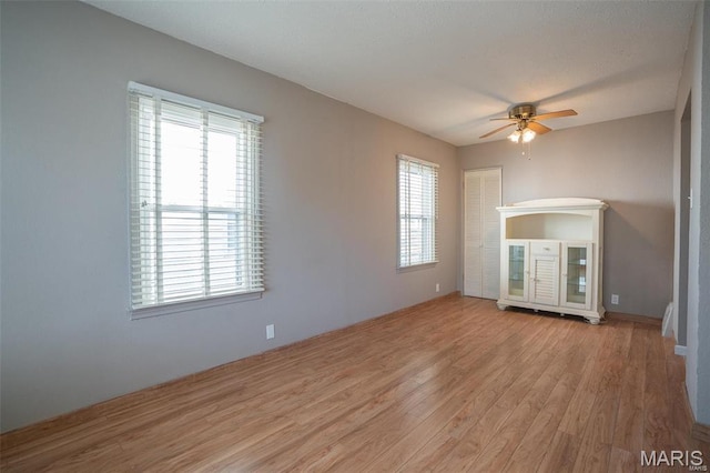 1745 Venice Ave, Granite City, IL 62040 - unfurnished living room with wood finished floors and ceiling fan