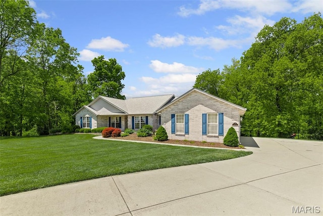 ranch-style house with a front lawn, brick siding, and concrete driveway