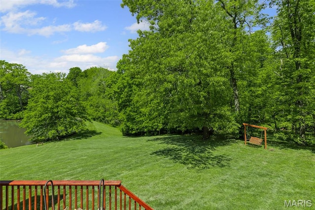 view of grassy yard with a water view