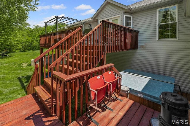 deck with a lawn and stairs