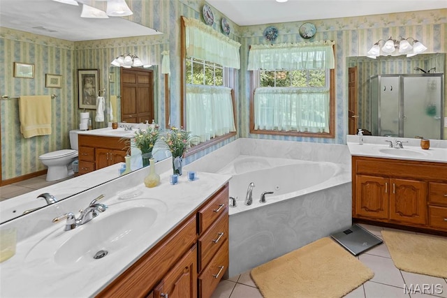bathroom with wallpapered walls, a stall shower, tile patterned flooring, two vanities, and a whirlpool tub