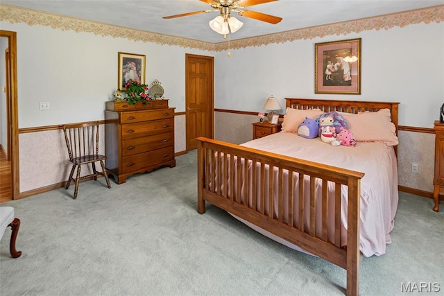 bedroom with carpet flooring, ceiling fan, and baseboards
