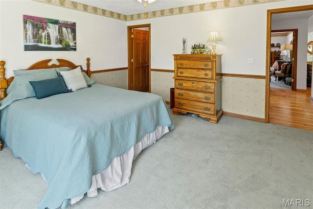 bedroom with carpet flooring and baseboards
