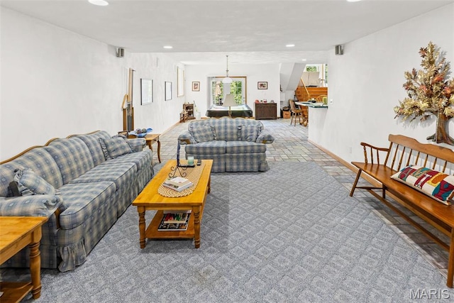living area featuring recessed lighting and baseboards