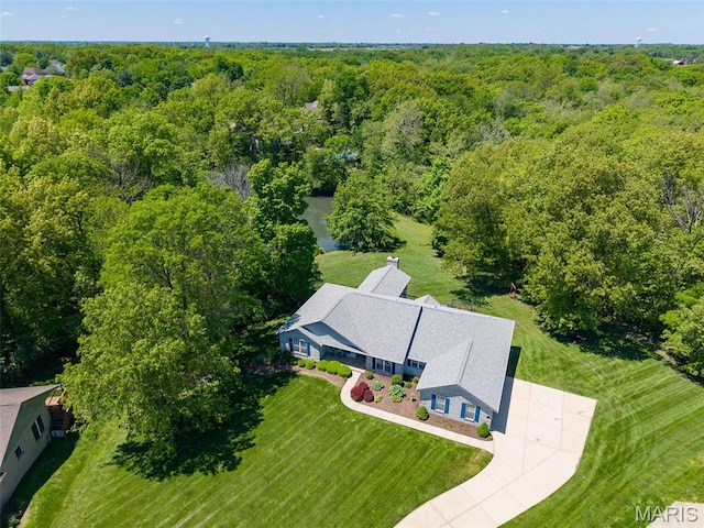 view from above of property featuring a forest