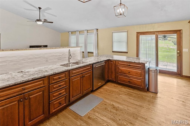 3708 Rhetts Lndg, Shiloh, IL 62221 - kitchen featuring a sink, dishwasher, lofted ceiling, light wood-style floors, and light stone countertops
