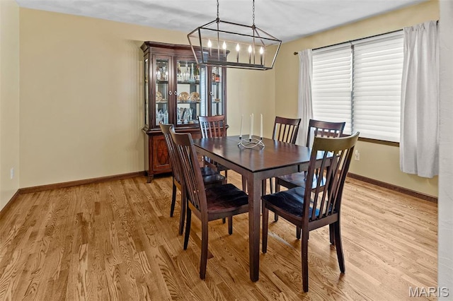 3708 Rhetts Lndg, Shiloh, IL 62221 - dining room featuring a chandelier, light wood finished floors, and baseboards