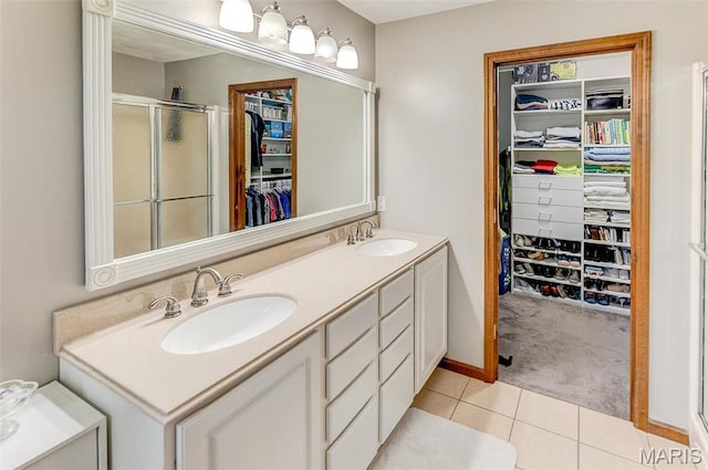 3708 Rhetts Lndg, Shiloh, IL 62221 - full bath featuring double vanity, tile patterned flooring, a spacious closet, and a stall shower
