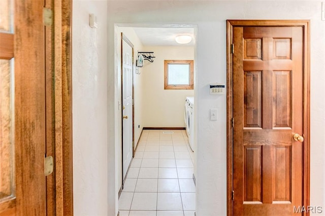 3708 Rhetts Lndg, Shiloh, IL 62221 - washroom featuring washer and clothes dryer, light tile patterned floors, and baseboards