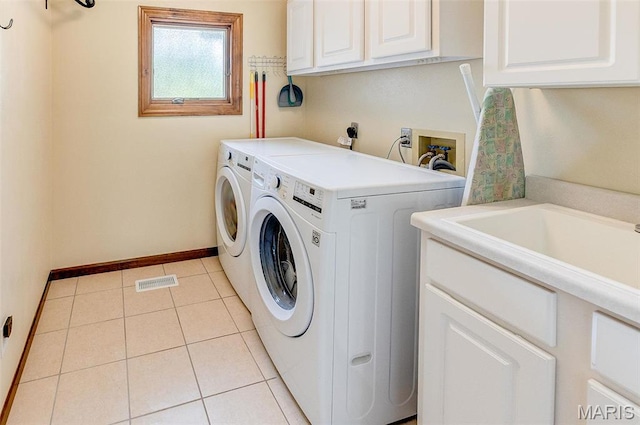 3708 Rhetts Lndg, Shiloh, IL 62221 - washroom with cabinet space, washer and clothes dryer, baseboards, and light tile patterned floors