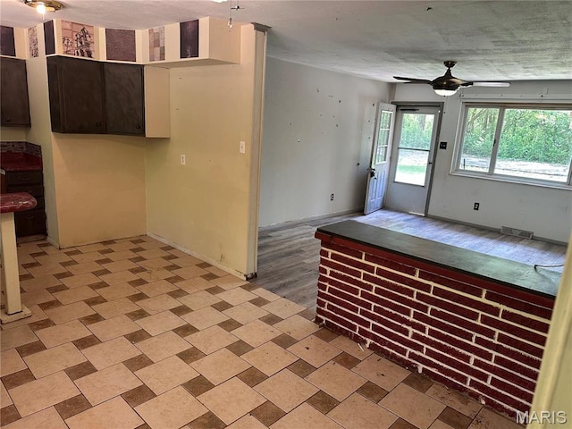 2145 Freckles Dr, High Ridge, MO 63049 - kitchen with ceiling fan, dark brown cabinets, and open floor plan