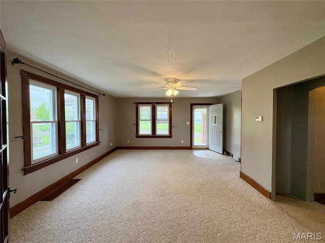 9621 Main St, Altenburg, MO 63732 - empty room featuring light colored carpet, baseboards, and ceiling fan