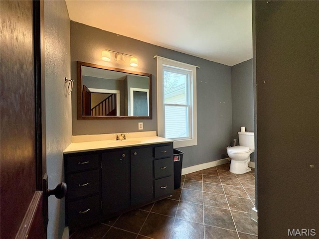 9621 Main St, Altenburg, MO 63732 - bathroom with toilet, tile patterned flooring, vanity, and baseboards