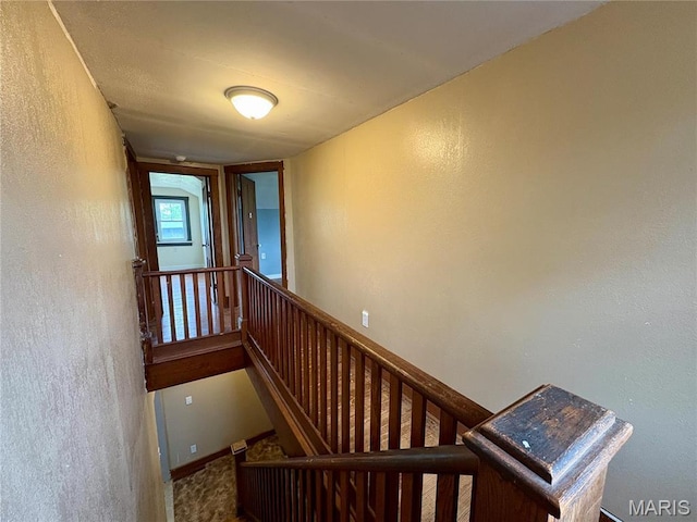 9621 Main St, Altenburg, MO 63732 - stairs featuring a textured wall and baseboards