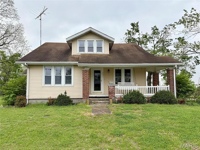 9621 Main St, Altenburg, MO 63732 - bungalow-style home featuring covered porch and a front lawn