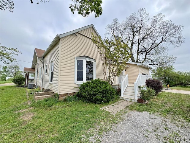 9621 Main St, Altenburg, MO 63732 - view of front facade with a front lawn and central AC unit