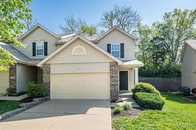 5541 Wavecrest Cir, Saint Charles, MO 63304 - traditional home with brick siding, driveway, a garage, and a front yard