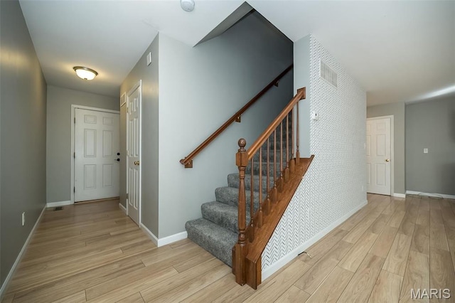 5541 Wavecrest Cir, Saint Charles, MO 63304 - entryway with light wood-style flooring, stairway, and baseboards