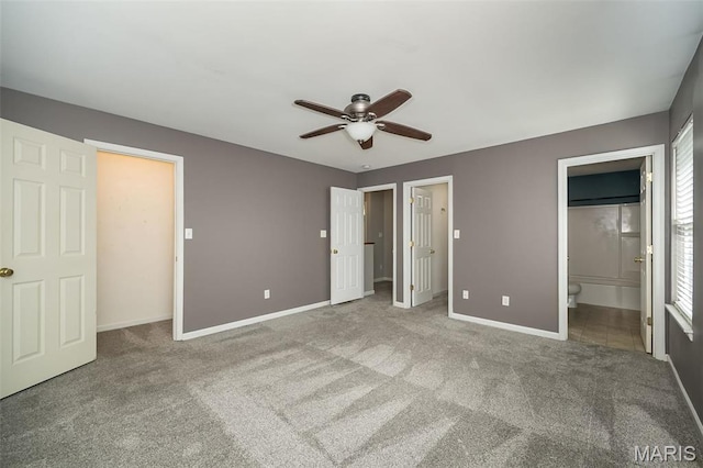 5541 Wavecrest Cir, Saint Charles, MO 63304 - unfurnished bedroom featuring baseboards, carpet, connected bathroom, and a ceiling fan