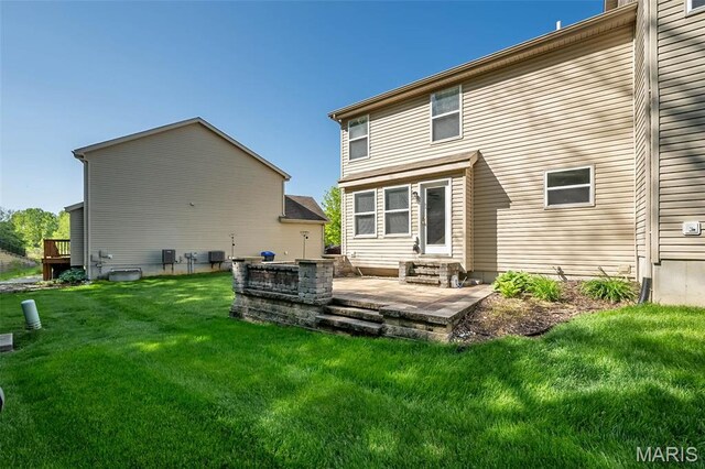 5541 Wavecrest Cir, Saint Charles, MO 63304 - back of property with a yard, a patio area, and cooling unit