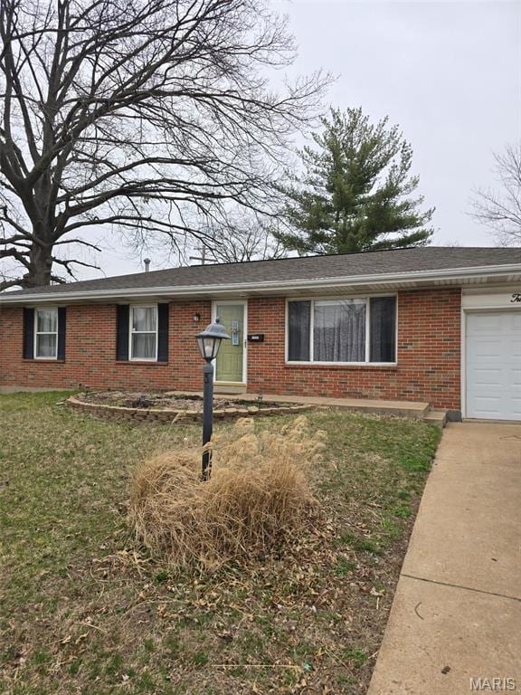 1205 Fox Run Dr, Florissant, MO 63033 - ranch-style house featuring brick siding, an attached garage, driveway, and a front lawn
