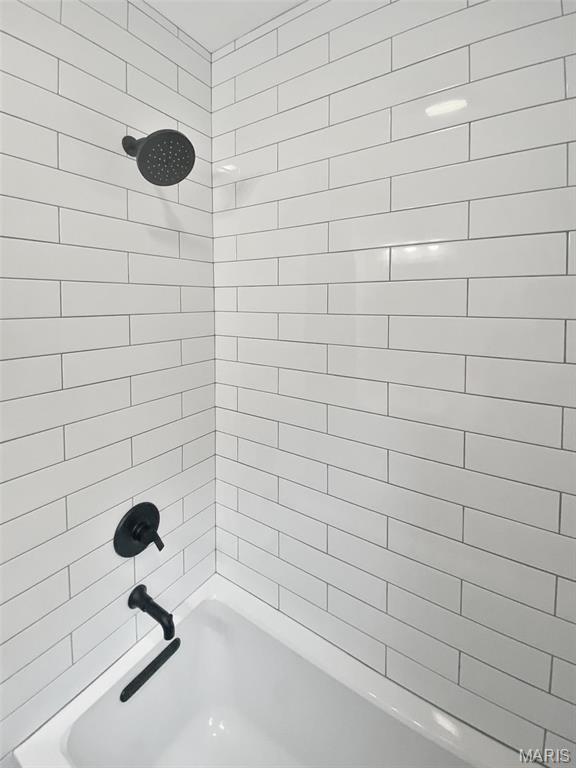 full bath featuring  shower combination