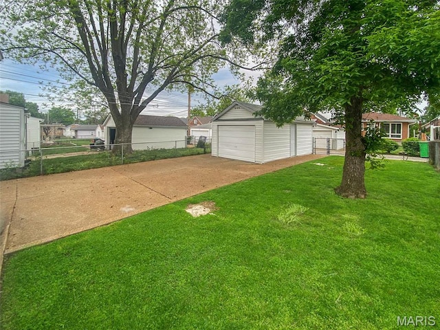 view of yard with a garage and an outdoor structure
