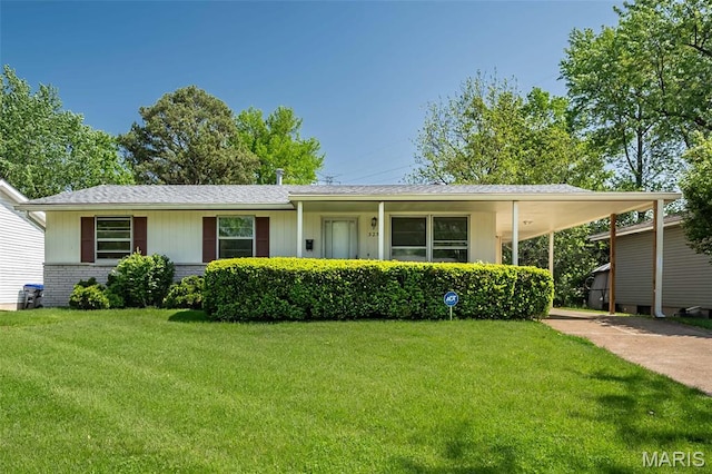 525 Angelus Dr, Florissant, MO 63031 - view of front of home featuring a front yard, concrete driveway, an attached carport, brick siding, and a shingled roof