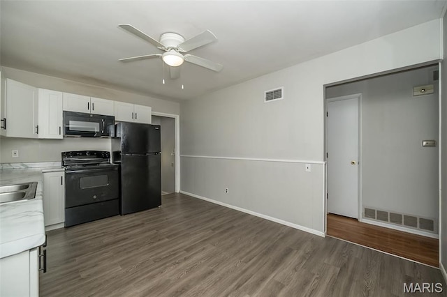 525 Angelus Dr, Florissant, MO 63031 - kitchen featuring black appliances, light countertops, ceiling fan, wood finished floors, and white cabinets