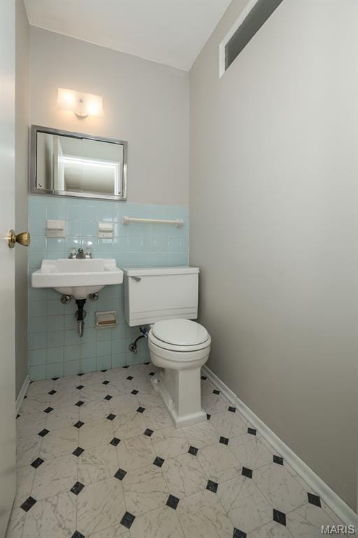 525 Angelus Dr, Florissant, MO 63031 - bathroom featuring toilet and a sink