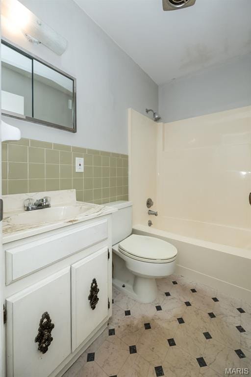 525 Angelus Dr, Florissant, MO 63031 - bathroom featuring  shower combination, toilet, tile walls, and vanity